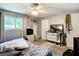 This bedroom features a ceiling fan, neutral colors, and plenty of natural light at 801 Nw 16Th Ct, Ocala, FL 34475