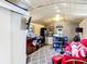 Cozy living space with kitchenette, red couch, and unique ceiling at 801 Nw 16Th Ct, Ocala, FL 34475