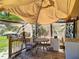 Enclosed porch featuring a table, chairs, and a mini-refrigerator at 801 Nw 16Th Ct, Ocala, FL 34475