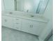 Bathroom with double vanity and white cabinets at 7433 Stone Creek Trl, Kissimmee, FL 34747