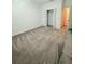 Spacious carpeted bedroom with closet for ample storage, offering comfort and style at 7433 Stone Creek Trl, Kissimmee, FL 34747