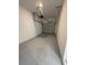 The garage of this house features concrete flooring and an open garage door at 7433 Stone Creek Trl, Kissimmee, FL 34747