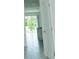 View of hallway leading to the living room with beautiful tile flooring at 7433 Stone Creek Trl, Kissimmee, FL 34747