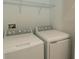 Convenient laundry room featuring a side-by-side washer and dryer at 7433 Stone Creek Trl, Kissimmee, FL 34747