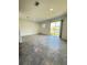 Bright living room with sliding glass doors to the outside and neutral-toned tile flooring at 7433 Stone Creek Trl, Kissimmee, FL 34747