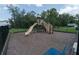 Community playground featuring a slide and climbing area at 7433 Stone Creek Trl, Kissimmee, FL 34747