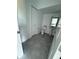 Stylish powder room with modern fixtures, tile flooring, and convenient closet at 7433 Stone Creek Trl, Kissimmee, FL 34747
