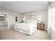 Inviting bedroom with a comfortable bed, neutral decor, and natural lighting at 11014 Nellie Crossing Cir, Clermont, FL 34711