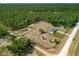 Expansive property featuring a home, mature trees, fencing and plenty of open space at 12396 Sw 64Th Street Rd, Ocala, FL 34481