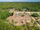 A home surrounded by mature trees and fenced-in pastures, offers a peaceful lifestyle at 12396 Sw 64Th Street Rd, Ocala, FL 34481