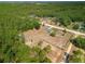 Picturesque aerial of sprawling property, fenced-in area, home, and wooded boundary at 12396 Sw 64Th Street Rd, Ocala, FL 34481