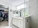 Bathroom featuring double vanity, glass enclosed shower, and walk-in closet at 12396 Sw 64Th Street Rd, Ocala, FL 34481