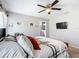 Comfortable bedroom with ceiling fan, closet, and ensuite bathroom access at 12396 Sw 64Th Street Rd, Ocala, FL 34481