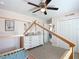 bedroom with a pink accent wall, wood laminate flooring, and a house-shaped bed frame at 12396 Sw 64Th Street Rd, Ocala, FL 34481