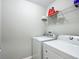 Functional laundry room equipped with modern appliances and ample shelving at 12396 Sw 64Th Street Rd, Ocala, FL 34481