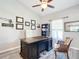 Home office featuring a large, traditional desk, ceiling fan, and many degrees on the wall at 12396 Sw 64Th Street Rd, Ocala, FL 34481