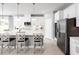 Bright kitchen featuring white cabinets, stainless steel appliances, and a large center island at 1722 Upland Ln, Winter Haven, FL 33884