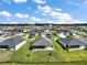 Beautiful aerial view of the homes with manicured lawns in a desirable planned community at 3315 Dzuro Dr, Oxford, FL 34484