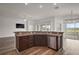 The breakfast bar is open to the great room with stainless dishwasher and sink at 3315 Dzuro Dr, Oxford, FL 34484