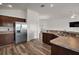 Open kitchen featuring stainless steel appliances and an open view of the living room at 3315 Dzuro Dr, Oxford, FL 34484