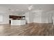 Bright and airy open-plan living space featuring recessed lighting and wood flooring at 3315 Dzuro Dr, Oxford, FL 34484