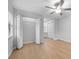Neutral bedroom featuring wood-look floors, ceiling fan, and closet providing plenty of storage space at 4856 Colonnades W Cir, Lakeland, FL 33811