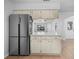 Bright kitchen featuring stainless steel refrigerator and ample counter space at 4856 Colonnades W Cir, Lakeland, FL 33811