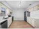 Well-lit kitchen featuring stainless steel appliances and ample counter space for convenient cooking at 4856 Colonnades W Cir, Lakeland, FL 33811