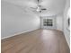 Spacious living room with laminate floors and plenty of natural light, offering a comfortable atmosphere at 4856 Colonnades W Cir, Lakeland, FL 33811
