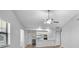 Open-concept living area with a view of the kitchen, creating an ideal space for entertaining at 4856 Colonnades W Cir, Lakeland, FL 33811