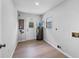 Clean utility room featuring hardwood floors, a water heater, and an exit door at 4856 Colonnades W Cir, Lakeland, FL 33811