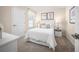 This bedroom features neutral paint, bright natural light, and plush carpet at 1196 Port Blue Way, Lady Lake, FL 32159