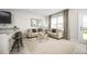 Stylish living room features neutral decor, comfortable seating, and an open layout at 1196 Port Blue Way, Lady Lake, FL 32159