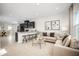 Open-concept living area features a spacious layout connecting the kitchen, dining, and living spaces at 1196 Port Blue Way, Lady Lake, FL 32159