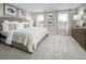 Comfortable main bedroom features plush carpet, neutral walls, and bright natural light at 1196 Port Blue Way, Lady Lake, FL 32159