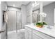 Modern bathroom with double sinks, quartz countertop, and a glass-enclosed shower at 1252 Turtle Island Rd, Lady Lake, FL 32159