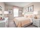 Cozy bedroom with soft lighting, pastel decor, and comfortable furnishings at 1252 Turtle Island Rd, Lady Lake, FL 32159