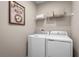 Convenient laundry room with a modern washer and dryer set and ample storage space at 1252 Turtle Island Rd, Lady Lake, FL 32159
