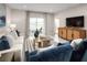 Comfortable living room with lake views, modern decor, and plenty of natural light at 1252 Turtle Island Rd, Lady Lake, FL 32159