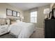 Inviting bedroom showcasing a neatly made bed, soft lighting, and a serene ambiance for relaxation at 2307 Incandescent Way, South Daytona, FL 32119