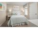 Charming bedroom featuring a queen bed, bedside tables, and window for natural light creating a cozy retreat at 2307 Incandescent Way, South Daytona, FL 32119