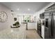 Open kitchen featuring stainless steel appliances and granite countertops at 2307 Incandescent Way, South Daytona, FL 32119