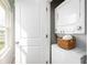Efficient laundry area featuring a stacked washer and dryer set, maximizing space and convenience at 2307 Incandescent Way, South Daytona, FL 32119