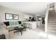 Inviting living area adjacent to the kitchen featuring stylish decor and easy access to the stairs at 2307 Incandescent Way, South Daytona, FL 32119