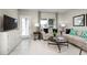 Cozy living room with neutral tones, stylish decor, and ample natural light at 2307 Incandescent Way, South Daytona, FL 32119