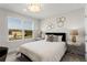 This bedroom features a large window, neutral walls, and stylish decor for a comfortable and inviting space at 3311 Grande Heron Dr, St Cloud, FL 34773
