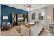Bright living room featuring a plush sofa, stylish decor, and large windows at 3311 Grande Heron Dr, St Cloud, FL 34773
