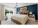 Comfortable bedroom with a large window, decorative pillows, and ample natural light at 3311 Grande Heron Dr, St Cloud, FL 34773