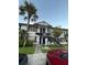Two-story apartment building with a palm tree in the foreground and a parking lot visible at 3651 N Goldenrod E Rd # 102, Winter Park, FL 32792