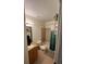 Well-lit bathroom featuring shower/tub combo with decorative shower curtain and granite countertops at 3651 N Goldenrod E Rd # 102, Winter Park, FL 32792